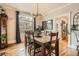 Well-lit dining room with a rustic wooden table and modern light fixture at 300 S Lincoln St, Denver, CO 80209