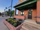 Well-maintained yard and front porch of charming two-story brick home at 300 S Lincoln St, Denver, CO 80209