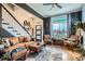 Inviting living room featuring a staircase and ample natural light from large window at 300 S Lincoln St, Denver, CO 80209