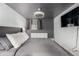 Comfortable bedroom featuring plush bed, white dresser, and a modern fan fixture at 1390 N Emerson St # 101, Denver, CO 80218