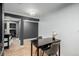Cozy dining area featuring modern black table set and decorative vase with white flower at 1390 N Emerson St # 101, Denver, CO 80218