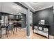 Open floorplan kitchen with stainless steel appliances and gray accent walls at 1390 N Emerson St # 101, Denver, CO 80218