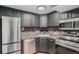 Modern kitchen featuring stainless steel appliances, sleek counters, and dark cabinets at 1390 N Emerson St # 101, Denver, CO 80218