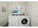Convenient laundry room featuring a pair of high-efficiency washer and dryer units at 1390 N Emerson St # 101, Denver, CO 80218