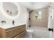 Modern bathroom with a stylish vanity, illuminated mirror, and a shower-tub combination at 3313 Jasmine St, Denver, CO 80207