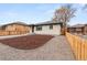 Front view of house with fresh gravel and mulch landscaping at 3313 Jasmine St, Denver, CO 80207