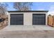 Spacious detached two-car garage with dark gray doors at 3313 Jasmine St, Denver, CO 80207