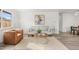 Bright living room features modern decor, neutral color palette, stylish furnishings, and plenty of natural light at 3313 Jasmine St, Denver, CO 80207