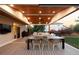 Lovely back deck featuring an outdoor dining area and an inviting lounge space with comfortable seating at 16658 Black Oak Ct, Parker, CO 80134