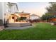 Large backyard features a deck and a covered patio with an outdoor dining area at 16658 Black Oak Ct, Parker, CO 80134