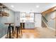 Finished basement featuring a wet bar, wine storage, and a nearby staircase at 16658 Black Oak Ct, Parker, CO 80134