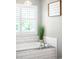 Bright bathroom features a soaking tub with subway tile surround and white plantation shutters at 16658 Black Oak Ct, Parker, CO 80134