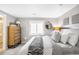 Comfortable bedroom featuring a large window, neutral paint, dresser and plush bed at 16658 Black Oak Ct, Parker, CO 80134