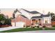 Charming two-story home with brick and siding, attached garage, basketball hoop, and beautifully landscaped front yard at 16658 Black Oak Ct, Parker, CO 80134