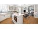 Spacious kitchen and dining area filled with natural light, an island, and stainless steel appliances at 16658 Black Oak Ct, Parker, CO 80134