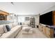 Finished basement featuring large comfy sectional, TV, and custom shelving and finishes at 16658 Black Oak Ct, Parker, CO 80134