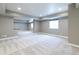 Unfinished basement with neutral gray walls, carpeted flooring, and ample natural light from windows at 578 Sage Grouse Cir, Castle Rock, CO 80109