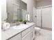 Sleek bathroom with a white vanity, stylish shower, and modern fixtures at 578 Sage Grouse Cir, Castle Rock, CO 80109