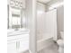 Well-lit bathroom showcasing a white vanity with a sink, and a tub-shower combo at 578 Sage Grouse Cir, Castle Rock, CO 80109