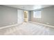 Bedroom with neutral paint, carpet, a window with shade, and an open doorway leading to the bathroom at 578 Sage Grouse Cir, Castle Rock, CO 80109