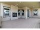 Covered deck with ample natural light, recessed lighting, dark-stained wood floors, and a fireplace at 578 Sage Grouse Cir, Castle Rock, CO 80109