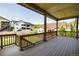 Spacious deck with wood railings offering views of neighboring houses and lush green lawn at 578 Sage Grouse Cir, Castle Rock, CO 80109