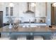 Gorgeous kitchen island provides ample counter space and seating, and stainless steel appliances at 578 Sage Grouse Cir, Castle Rock, CO 80109