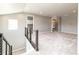Spacious loft area with staircase and carpet, perfect for a recreation room or office space at 578 Sage Grouse Cir, Castle Rock, CO 80109