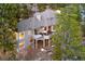 Aerial view of home highlighting the extensive outdoor living space and wooded setting at 30082 Troutdale Ridge Rd, Evergreen, CO 80439