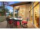 Inviting back deck with an outdoor dining table set and wooded views at 30082 Troutdale Ridge Rd, Evergreen, CO 80439