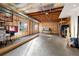 Unfinished basement with natural light exposure from two windows and exposed ceiling at 30082 Troutdale Ridge Rd, Evergreen, CO 80439