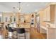 Gourmet kitchen featuring custom cabinets, granite countertops, and stainless steel appliances at 30082 Troutdale Ridge Rd, Evergreen, CO 80439