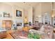 Cozy living room with a beautiful fireplace, high ceilings, and comfortable furnishings at 30082 Troutdale Ridge Rd, Evergreen, CO 80439