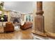 Comfortable living room with a stone fireplace and a leather sofa set at 30082 Troutdale Ridge Rd, Evergreen, CO 80439