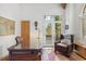 Bright office with a large window and a doorway that leads to the outside deck at 30082 Troutdale Ridge Rd, Evergreen, CO 80439