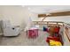 Bright playroom with a teepee, table, rocking horse, and other toys at 30082 Troutdale Ridge Rd, Evergreen, CO 80439