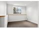 A small spare room with light brown carpet, white walls, and a single window at 30082 Troutdale Ridge Rd, Evergreen, CO 80439