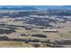 Panoramic view of a sprawling landscape with several homes in the distance at 5549 Lake Gulch Rd, Castle Rock, CO 80104