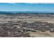 Distant aerial view of home with snowy mountain range in the distance at 5549 Lake Gulch Rd, Castle Rock, CO 80104