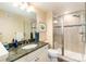 Bathroom featuring granite counters, modern fixtures, and a glass-enclosed shower at 5549 Lake Gulch Rd, Castle Rock, CO 80104