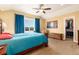 Spacious bedroom with a walk-in closet, vaulted ceiling, and a scenic view from the window at 5549 Lake Gulch Rd, Castle Rock, CO 80104