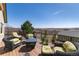 Outdoor deck with wicker seating and scenic views of the surrounding landscape at 5549 Lake Gulch Rd, Castle Rock, CO 80104