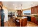 Spacious kitchen featuring a center island and scenic mountain views at 5549 Lake Gulch Rd, Castle Rock, CO 80104