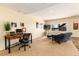 Versatile living room with a home office space, bright lighting, and comfortable furnishings at 5549 Lake Gulch Rd, Castle Rock, CO 80104
