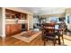 Inviting open floor plan with a dining area and built-in bar, perfect for entertaining at 5549 Lake Gulch Rd, Castle Rock, CO 80104