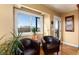 Cozy sitting area with hardwood floors, natural light, and mountain views at 5549 Lake Gulch Rd, Castle Rock, CO 80104