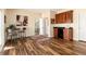 Well-equipped wet bar featuring wood cabinets, a sink, and a mini-refrigerator at 5549 Lake Gulch Rd, Castle Rock, CO 80104