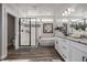 Elegant bathroom featuring a soaking tub, walk-in shower, dual vanity, and stylish fixtures and finishes at 3256 Offbeaten Pl, Castle Rock, CO 80108