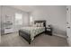Cozy bedroom with natural light, a comfortable bed, and a soothing color palette for relaxation at 3256 Offbeaten Pl, Castle Rock, CO 80108