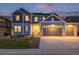 Attractive two-story home with a three-car garage, well-kept lawn, and inviting curb appeal at 3256 Offbeaten Pl, Castle Rock, CO 80108